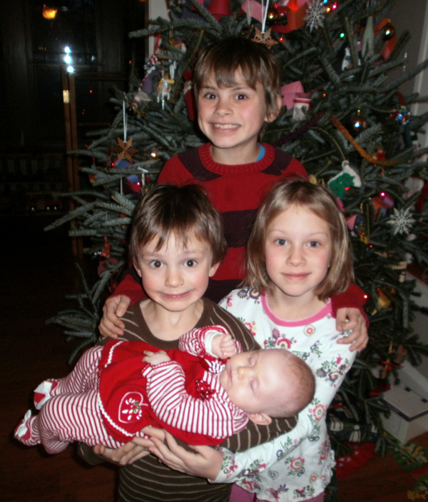 The Kids in Front of the Christmas Tree