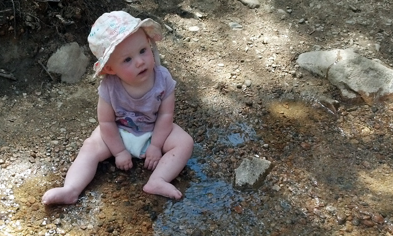 Lucia Playing in the Creek